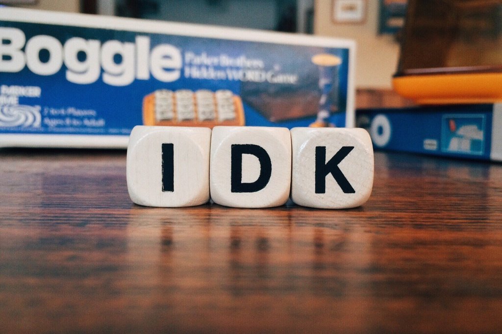 A picture of Boggle dice with the letters I K D, introducing the idea that if you don't know your own business, my English copywriting service won't be of much help