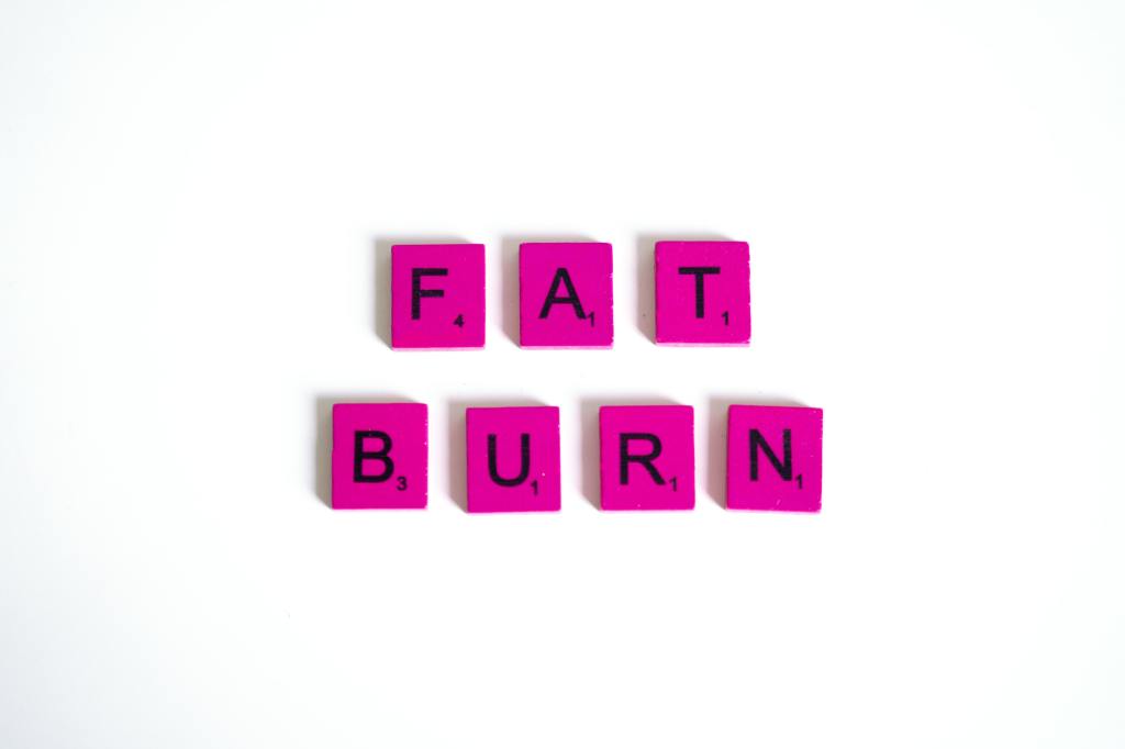 A picture of pink scrabble tiles spelling fat burn, to introduce the difference in the terms skinny, thin, and slim