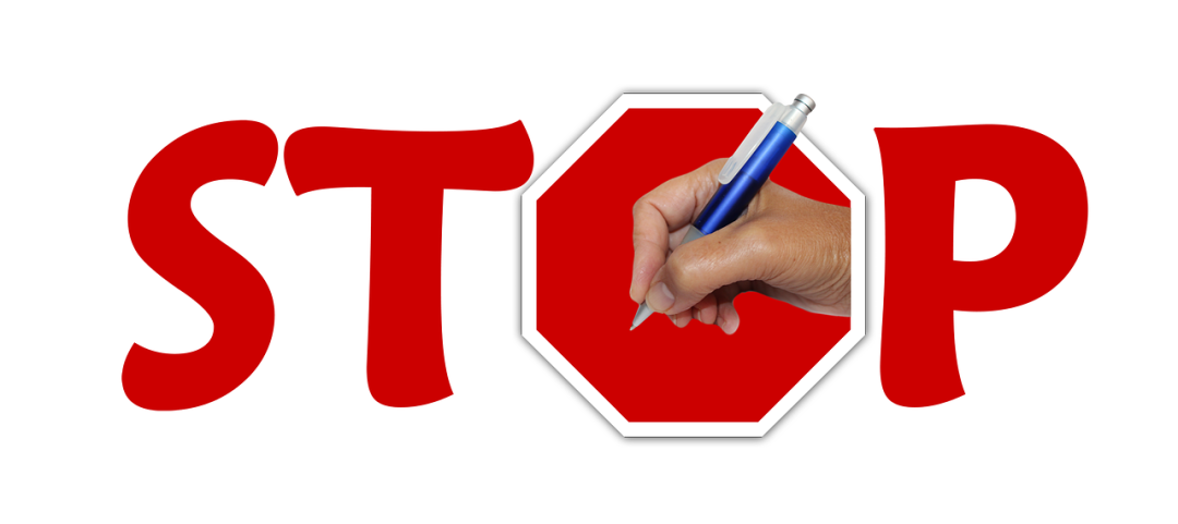 A vector image of the word stop with a hand holding a pen in the O, which looks like a stop sign. Introducing the topic that language learners should stop learning more new words to improve their comprehension